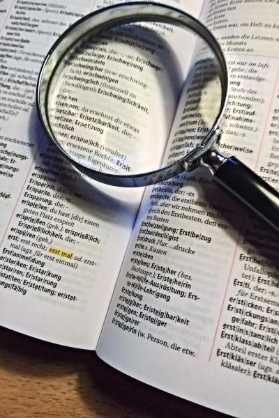  Canva_-_Magnifying_Glass_On_A_Book.jpg
